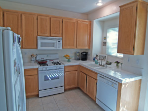 Bright kitchen opens to spacious backyard