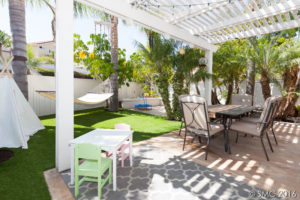 Large backyard with new artificial turf